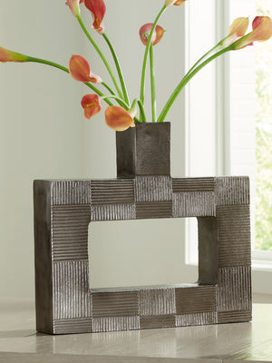  this vase-'s contemporary geometric form acts as a captivating focal point for your mantle or bookshelf. Its antiqued nickel-tone body is detailed with subtle texture for added visual appeal. What a perfect fit for those seeking 