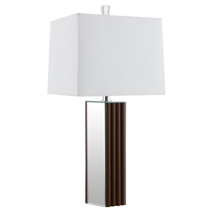 Establish a chic look and feel in your living room with a modern table lamp design. It-'s a rich, warm choice, featuring a deep brown finish and scallop details that create a sense of texture and artisan character. Mirror panels add brightness and reflect