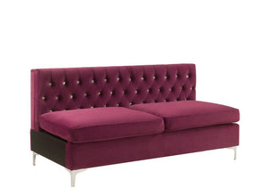 Nothing screams luxury like this Jaszira modular upholstery group. Each piece is enveloped in a luxurious velvet upholstery and showcasing button tufting, and a nail head trim accent for a tailored touch. Foam padding offers comfortable cushioning. Design