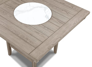  finely crafted table with a built-in faux marble turntable and open lower shelf in a we