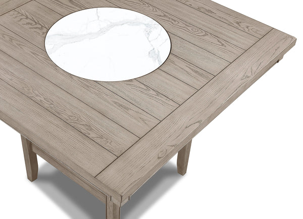  finely crafted table with a built-in faux marble turntable and open lower shelf in a we