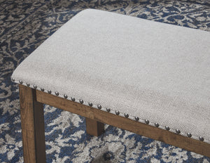  this upholstered dining bench entices with warmth and earthy elegance. Cushioned seat accommodate