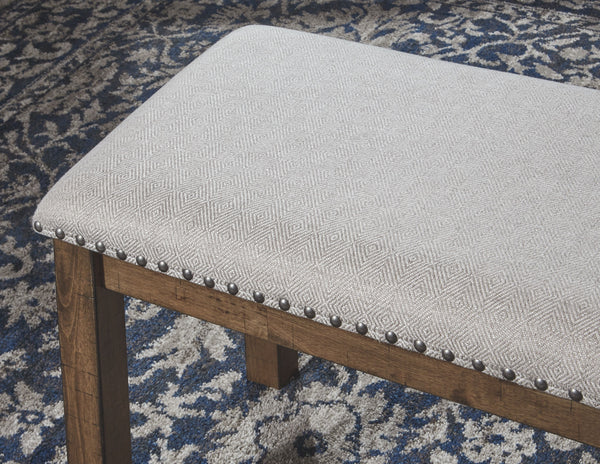  this upholstered dining bench entices with warmth and earthy elegance. Cushioned seat accommodate
