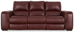 Impressive in scale while keeping an air of refinement, this power reclining sofa stuns with a combination of soft, supple leather and perfectly matched faux leather upholstery in garnet. Sink into the seating area and cater to your comfort with one-touch