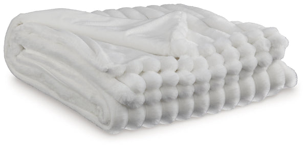 As cozy as they come, this faux fur throw turns your seating area into a haven of comfort. Its neutral hue acts as the perfect foundation for layering, whether mixed with pillows or draped over the arm of a sofa. And itâ€™s machine washable, so you can sp