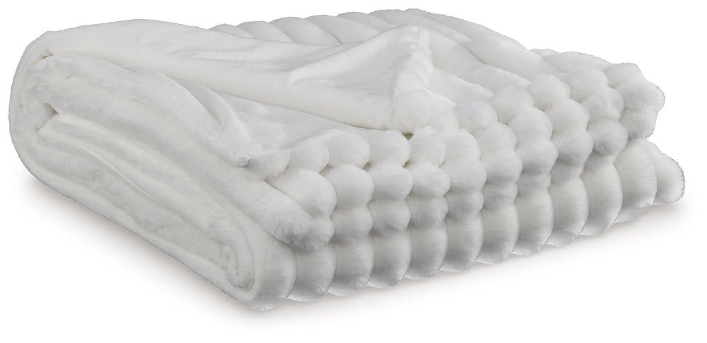 As cozy as they come, this faux fur throw turns your seating area into a haven of comfort. Its neutral hue acts as the perfect foundation for layering, whether mixed with pillows or draped over the arm of a sofa. And itâ€™s machine washable, so you can sp