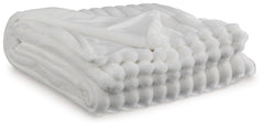 As cozy as they come, this faux fur throw turns your seating area into a haven of comfort. Its neutral hue acts as the perfect foundation for layering, whether mixed with pillows or draped over the arm of a sofa. And itâ€™s machine washable, so you can sp