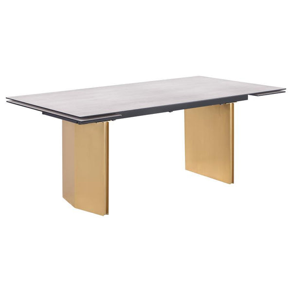 This modern dining table showcases a stunning beige glass top with a 3D-printed design, supported by a brushed gold stainless steel base for a sophisticated and luxurious look. Perfect for hosting, the table features two 12-inch refractory extension leave