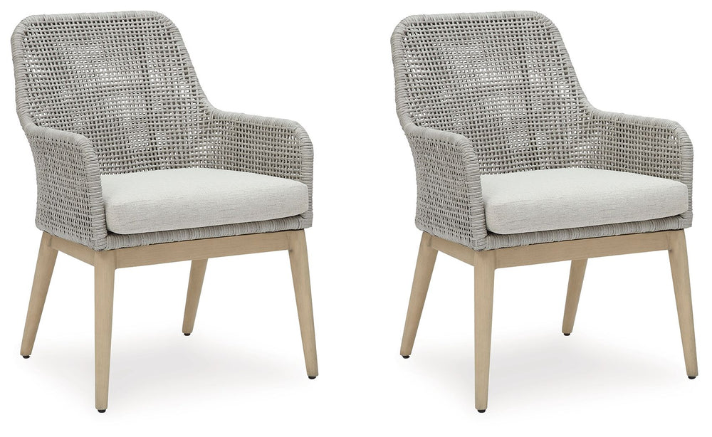 This dining arm chair invites your casual contemporary style outdoors. With its resin wicker in a chic neutral hue, it expertly marries refined design with durability. Breezy summer mornings and cold winter nights are made all the more comfortable with hi