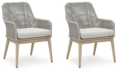 This dining arm chair invites your casual contemporary style outdoors. With its resin wicker in a chic neutral hue, it expertly marries refined design with durability. Breezy summer mornings and cold winter nights are made all the more comfortable with hi