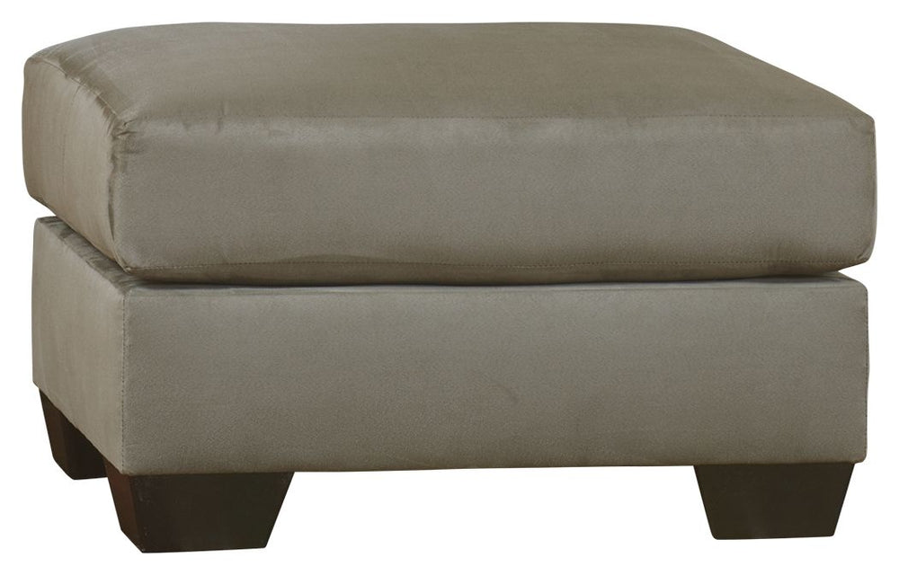 Talk about fine lines and great curves. Thatâ€™s the beauty of this ottomanâ€”made to suit your appreciation for simplicity and love of contemporary style. Tapered feet and ultra-soft upholstery that holds up to everyday living complete this fashion state