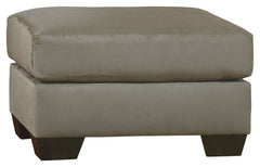 Talk about fine lines and great curves. Thatâ€™s the beauty of this ottomanâ€”made to suit your appreciation for simplicity and love of contemporary style. Tapered feet and ultra-soft upholstery that holds up to everyday living complete this fashion state