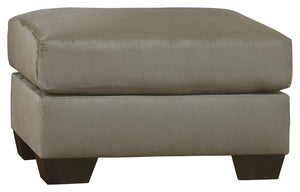 Talk about fine lines and great curves. Thatâ€™s the beauty of this ottomanâ€”made to suit your appreciation for simplicity and love of contemporary style. Tapered feet and ultra-soft upholstery that holds up to everyday living complete this fashion state