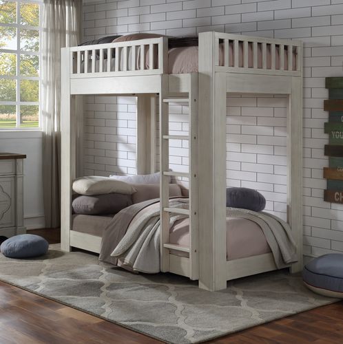 This bunk bed strikes a classic silhouette with vertically slatted guardrails. Each bed features a slat system (14+14) to accommodate your preferred mattresses (not included) without the need for bulky box springs or bunkie boards. The low-profile bottom 