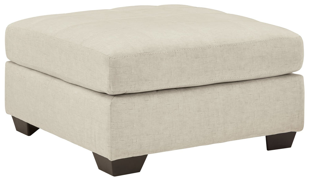 Destination: urban oasis. Elevate your design aesthetic with a chic look inspired by city living. Sleek, sultry and tailored to a T, this oversized accent ottoman lures with comfortably soft box cushions and dramatic jumbo stitching for fashion-forward fl