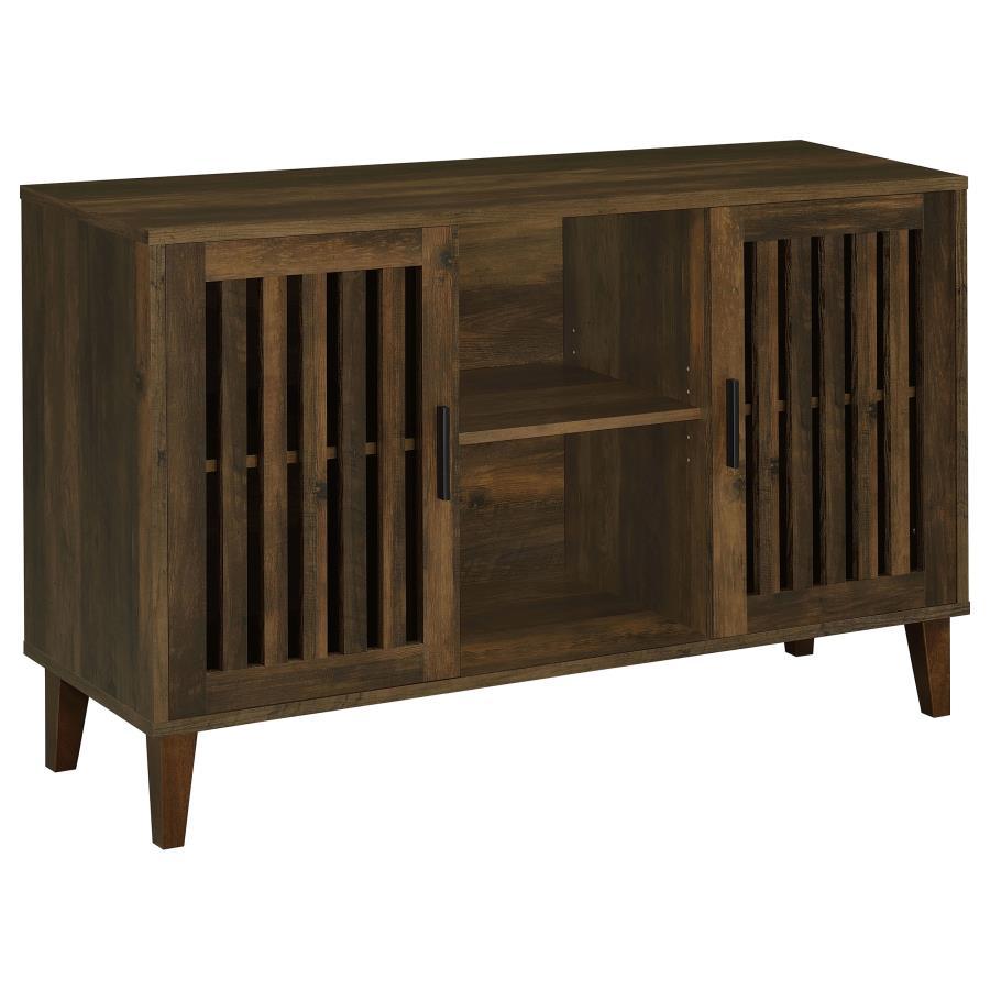 Lean rustic in a bold farmhouse-industrial style setting with a spacious accent cabinet. Ideal for both dining rooms and media spaces, the Torin accent cabinet is built of dramatic dark pine finished rubberwood and wood products with woodgrain markings. S