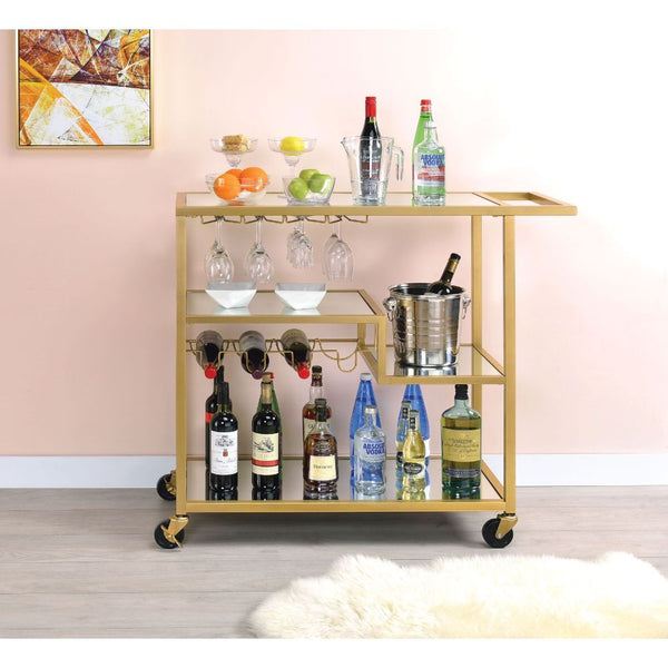 With its shimmering tiers, this Adamsen serving cart will catch the light for a stylish sparkle to complement neutral spaces. The clean-lined design crafted of a gold finish, a mirrored top, and bottom shelf, two center shelves with different heights to d
