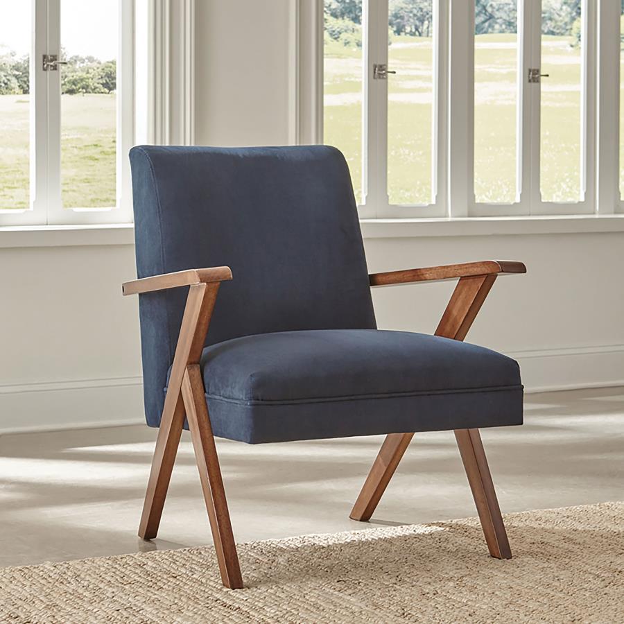 Go bold in both tones and silhouette when you add this fabric accent chair to your home. Chair is upholstered in soft dark blue fabric. Padded seat and back cushions provide hours of comfort. Rich brown armrests and legs offer warmth and support. It-'s a 