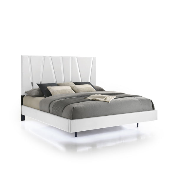 The Europa Panel Bed in white offers a perfect blend of modern elegance and quality craftsmanship. This set includes a panel headboard, footboard, two side rails, and four mattress support slats. Its sleek design is achieved with a majestic headboard, glo