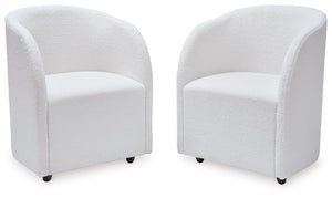 Inspired by art deco design, this fully upholstered dining chair makes a lasting impression in a simply stunning way. Its magnificent curved silhouette is enhanced with a neutral boucle upholstery thatâ€™s so pleasing to the palate. This is the piece youâ
