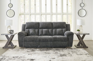  this extra-spacious reclining sofa is a masterclass in accessible style. Plush
