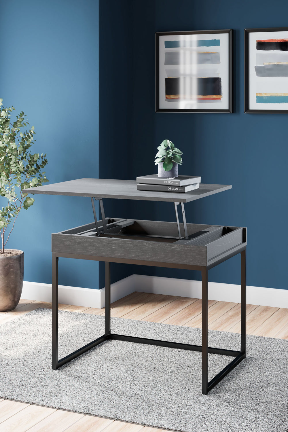 Elevate your home office with this simply sensational lift-top desk. Pairing a dark wood grain look with a black metal base for modern appeal, this minimalistic desk is dressed to impress in a no-muss, no-fuss way. Small storage bins underneath the sleek 