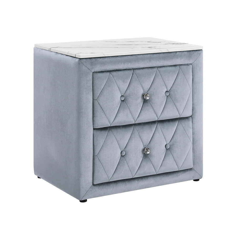 This elegant nightstand brings a touch of luxury to any bedroom with its rich, velvety texture and diamond-patterned tufting. The soft, plush exterior is complemented by gleaming crystal-like drawer knobs, adding a hint of glamour. With two spacious drawe