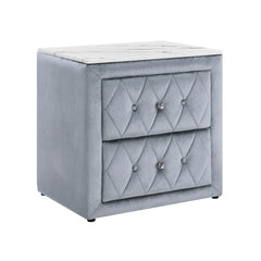 This elegant nightstand brings a touch of luxury to any bedroom with its rich, velvety texture and diamond-patterned tufting. The soft, plush exterior is complemented by gleaming crystal-like drawer knobs, adding a hint of glamour. With two spacious drawe