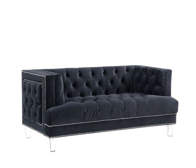 Sophistication meets modern with the Ansario living room collection. The rich blue velvet adds character to any room. Showcasing a square back, high arms, and nail-head trim, feature button tufted accents. The acrylic legs give off a modern vibe to the pi