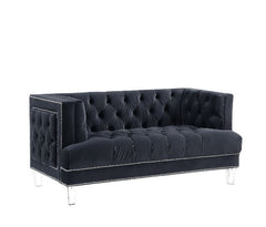 Sophistication meets modern with the Ansario living room collection. The rich blue velvet adds character to any room. Showcasing a square back, high arms, and nail-head trim, feature button tufted accents. The acrylic legs give off a modern vibe to the pi