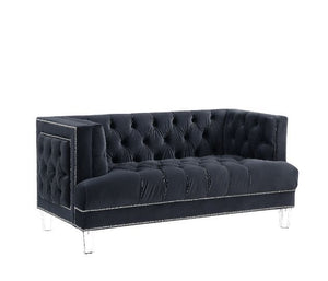 Sophistication meets modern with the Ansario living room collection. The rich blue velvet adds character to any room. Showcasing a square back, high arms, and nail-head trim, feature button tufted accents. The acrylic legs give off a modern vibe to the pi