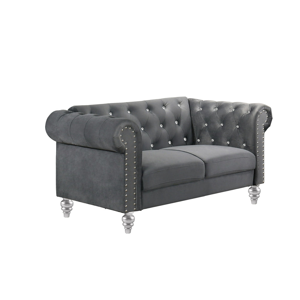 The New Classic Emma Chesterfield Velvet 2 Seat Sofa Loveseat is a blend of soft elegance and sophisticated design. Crafted from 100% polyester velvet fabric, it offers cozy and indulgent seating for two. The glam tailoring features tufted backs and arms 