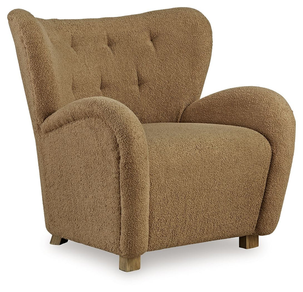 High style meets relaxation in this accent chair. Cozy faux shearling fabric keeps the look contemporary without compromising on comfort. A tufted wingback design and dramatic slope arms add high-fashion flair. It-'s the perfect place to curl up and enjoy