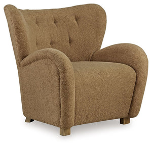 High style meets relaxation in this accent chair. Cozy faux shearling fabric keeps the look contemporary without compromising on comfort. A tufted wingback design and dramatic slope arms add high-fashion flair. It-'s the perfect place to curl up and enjoy