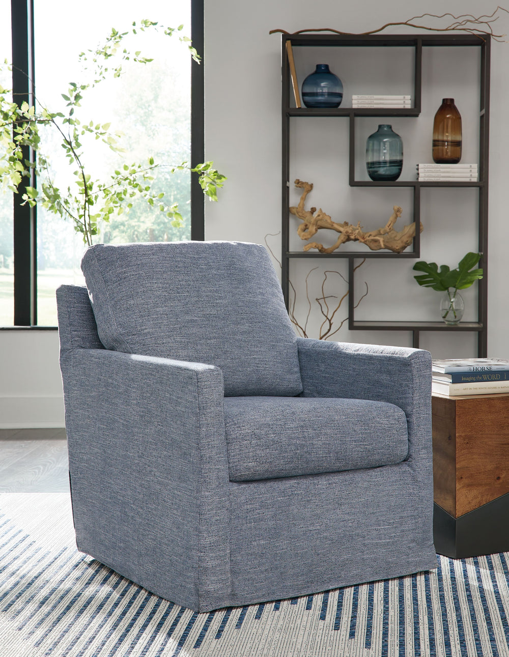 This swivel glider accent chair makes everyday lounging refreshingly low-maintenance. Handle spills with ease thanks to washable performance fabric. This chair delivers form and function all in one, keeping messes manageable so you donâ€™t have to.<br><br