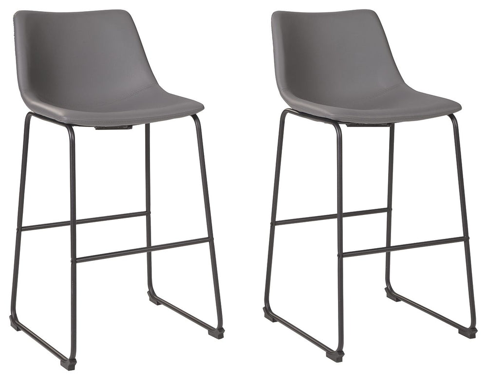 With its distinctive contoured bucket seat and tubular metal base, this bar stool serves up a fresh twist on mid-century inspired style. Chic gray faux leather upholstery adds to the aesthetic. What a timeless look for eat-in kitchens and casually cool di