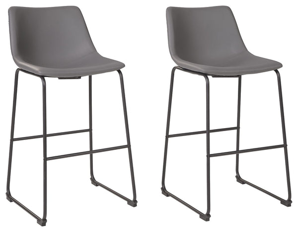With its distinctive contoured bucket seat and tubular metal base, this bar stool serves up a fresh twist on mid-century inspired style. Chic gray faux leather upholstery adds to the aesthetic. What a timeless look for eat-in kitchens and casually cool di