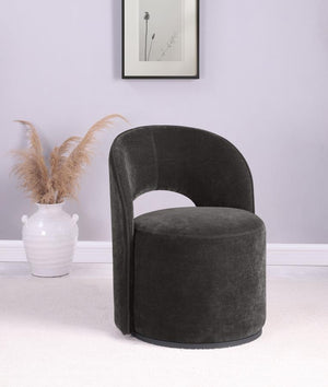  featuring luxurious velvet upholstery. Its curved silhouette and 360-degree rotation enhance versatile seating arrangements. Perfect for a living room corner or reading nook