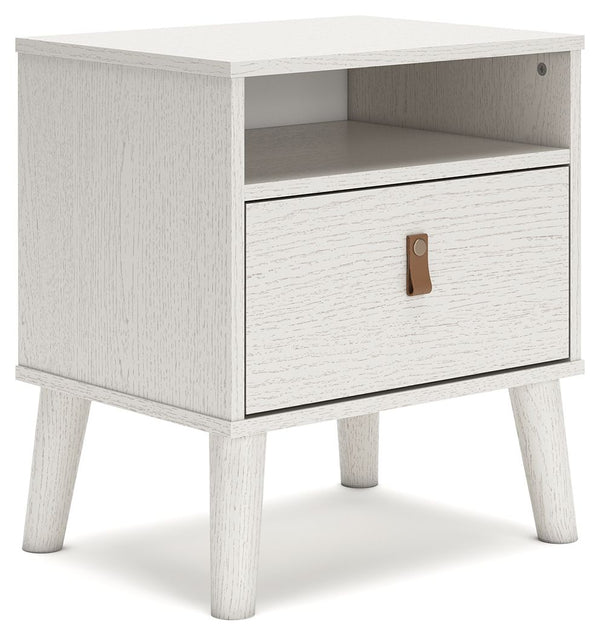 Dare to take minimalism to the max. This nightstand has an air of sleek simplicity thanks to its white painted finish with subtle replicated wood grain. Magnificently mod splay legs are a compelling complement to the streamlined design. And with two diffe