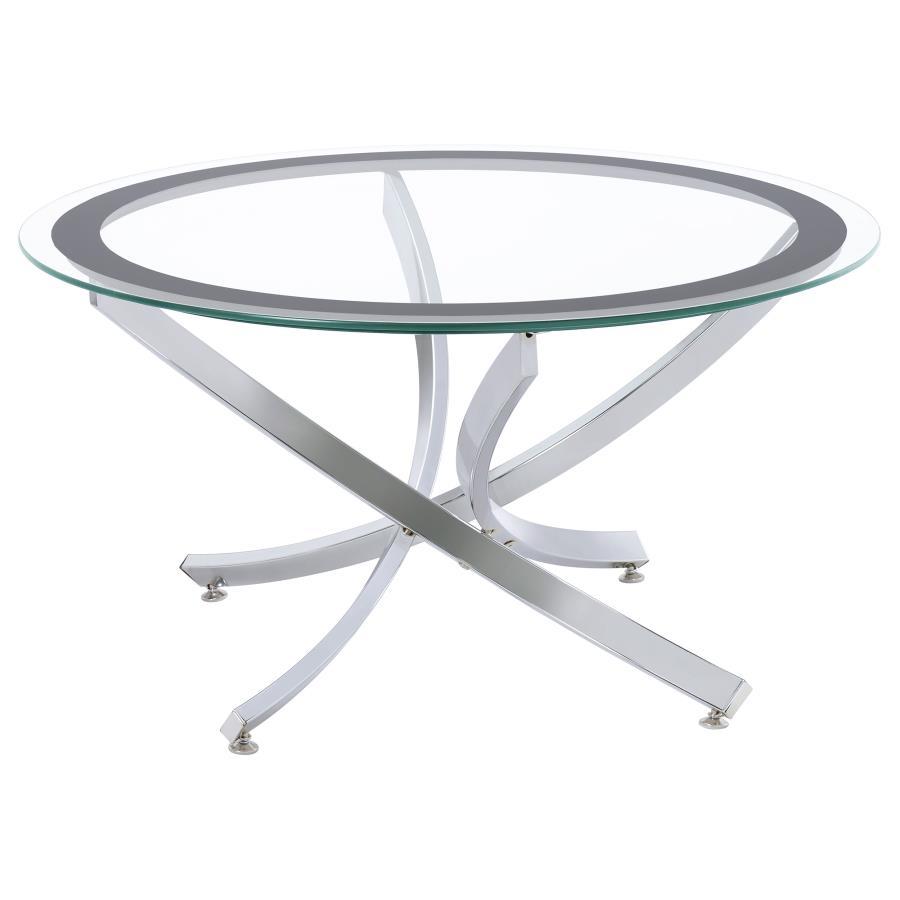 Infuse your living space with the warmth of a contemporary coffee table, designed to harmoniously blend modernity and comfort. The artfully curved, crisscrossing metal base is electroplated for a lustrous finish, supporting a clear tempered glass top enci