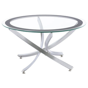 Infuse your living space with the warmth of a contemporary coffee table, designed to harmoniously blend modernity and comfort. The artfully curved, crisscrossing metal base is electroplated for a lustrous finish, supporting a clear tempered glass top enci