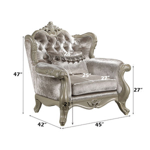  and armrests with a wooden inner frame. The tight back and loose seat cushions