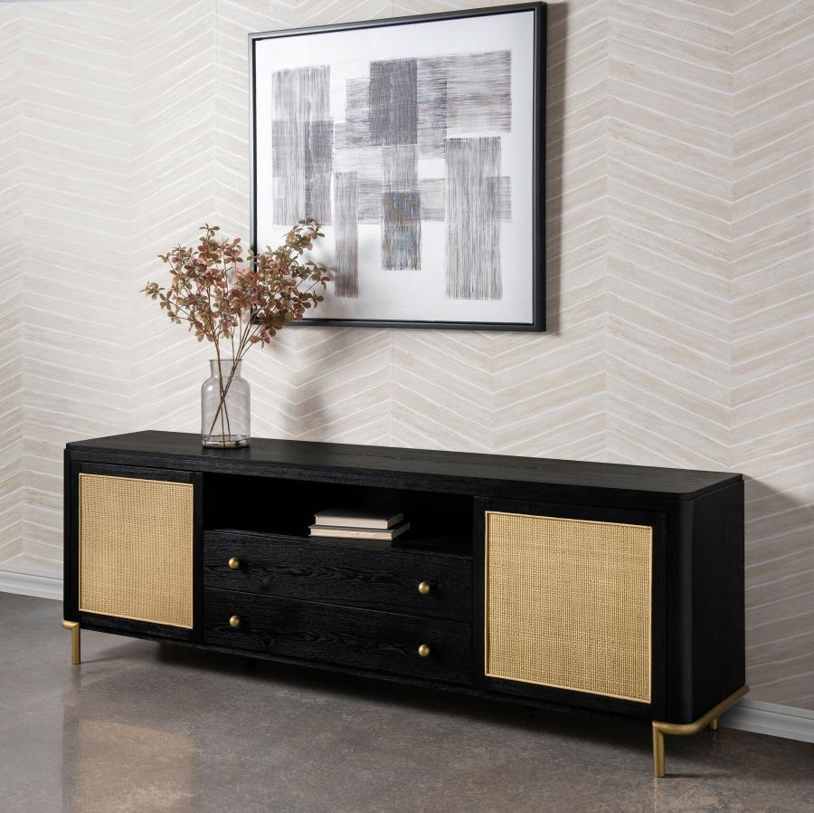 This refined entertainment unit transforms your living room with artisanal detail. Accommodating up to 85-inch displays, this TV stand integrates Asian hardwood, engineered wood, ash veneer, and rattan. A modern neutral finish and aged brass legs exude ti