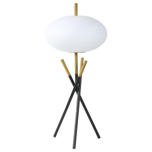 This table lamp offers a striking modern design with its unique tripod base and frosted globe-shaped shade. Crafted with a combination of sleek black and gold metal finishes, the lamp exudes elegance and contemporary charm. The frosted plastic shade provi