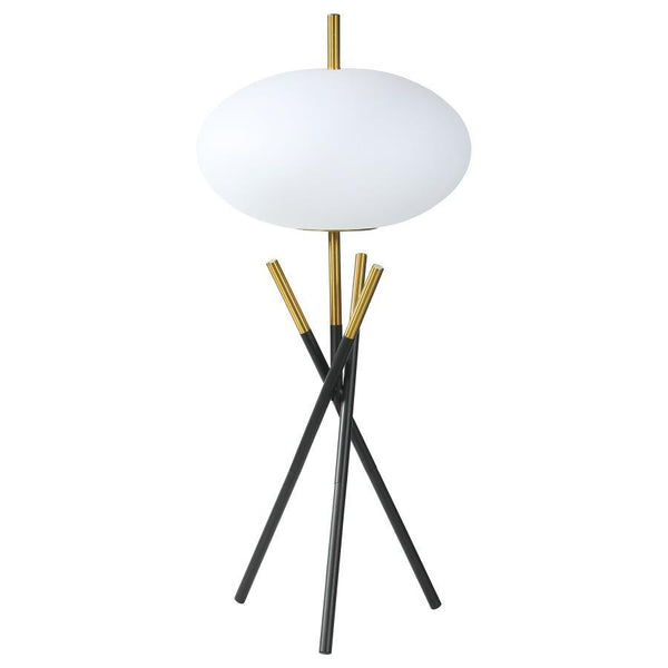 This table lamp offers a striking modern design with its unique tripod base and frosted globe-shaped shade. Crafted with a combination of sleek black and gold metal finishes, the lamp exudes elegance and contemporary charm. The frosted plastic shade provi