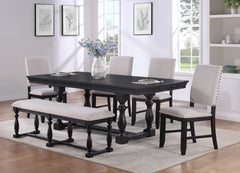 Make a bold statement in your dining space with this stunning and elegantly crafted dining group. Featuring a richly finished table with intricately carved turned legs and a sophisticated trestle base, this set exudes timeless charm and durability. The up