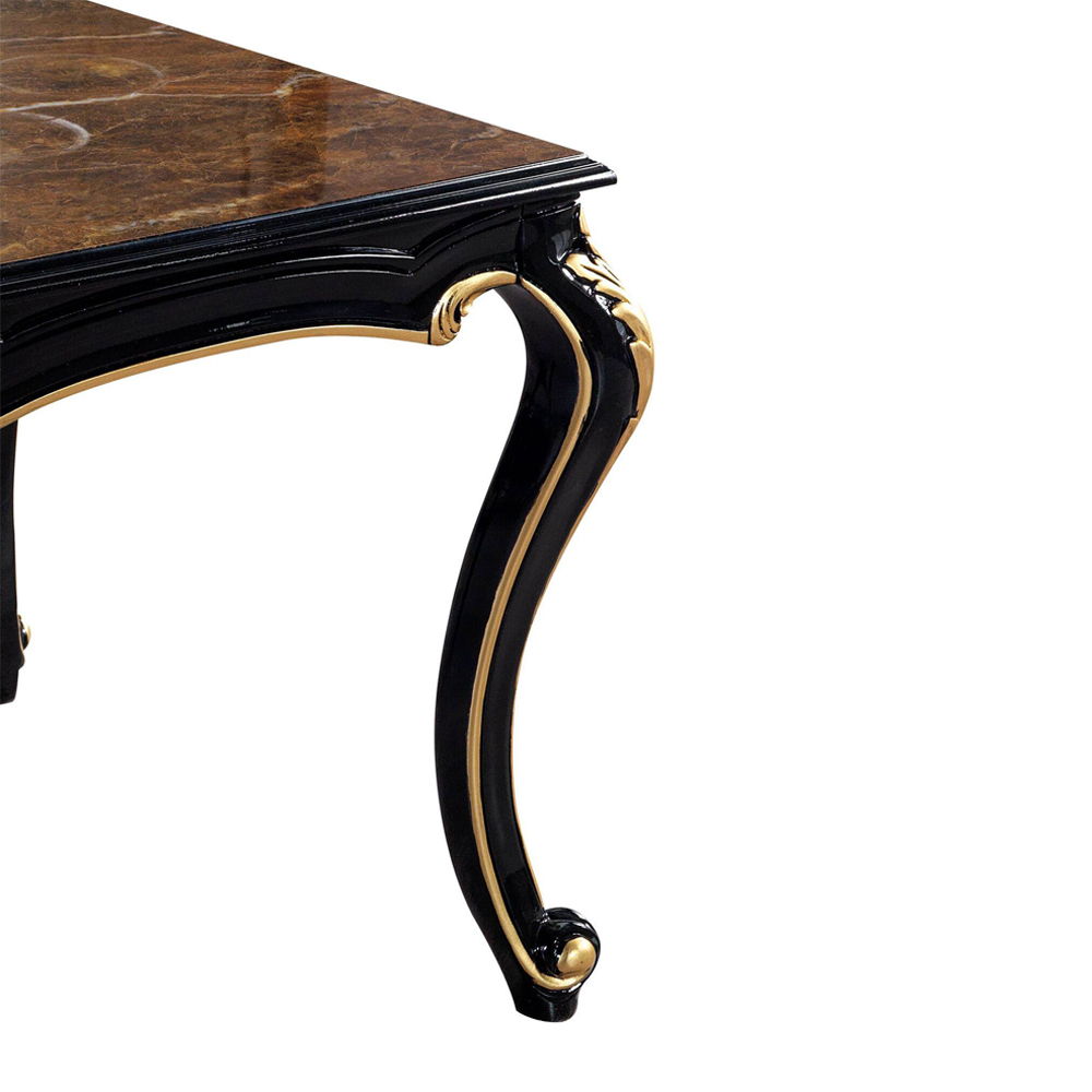 In a modern shiny piano black and gold colorway, the Betria end table is both contemporary and timeless. Gold paint accentuates the carved details against the black foundation. Engineered stone makes up the tabletop for an eye-catching and durable finish.
