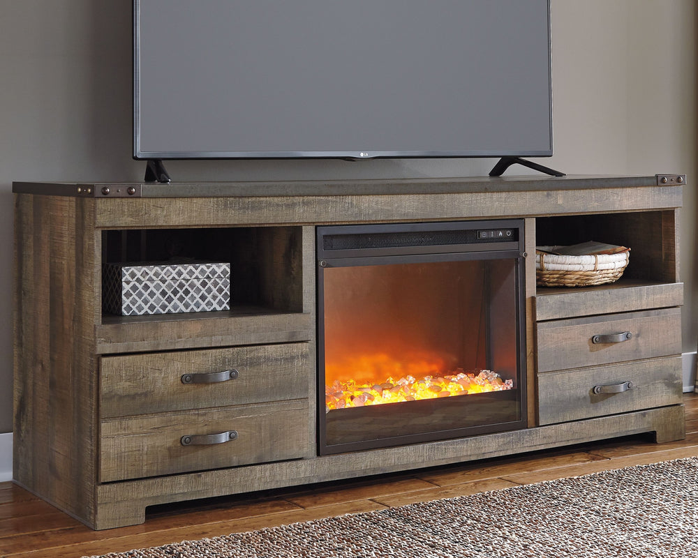 This TV stand with fireplace option makes home on the range look so alluring. The aesthetic is earthy yet clean and sophisticated, with a rustic finish, plank-style details and nailhead trim that pay homage to reclaimed barn wood. Removing the center shel