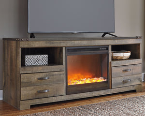 This TV stand with fireplace option makes home on the range look so alluring. The aesthetic is earthy yet clean and sophisticated, with a rustic finish, plank-style details and nailhead trim that pay homage to reclaimed barn wood. Removing the center shel