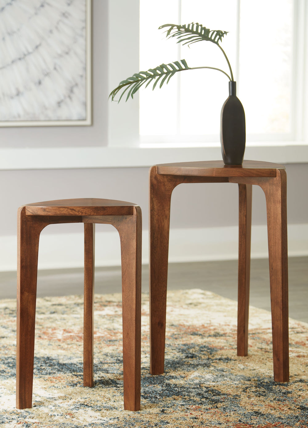 This accent table set brings beautiful versatility to your contemporary living room. Stage the tables as a nesting pair to create the look of a dynamically layered coffee table. Place next to your favorite sofa or chair to keep sofa-side essentials within